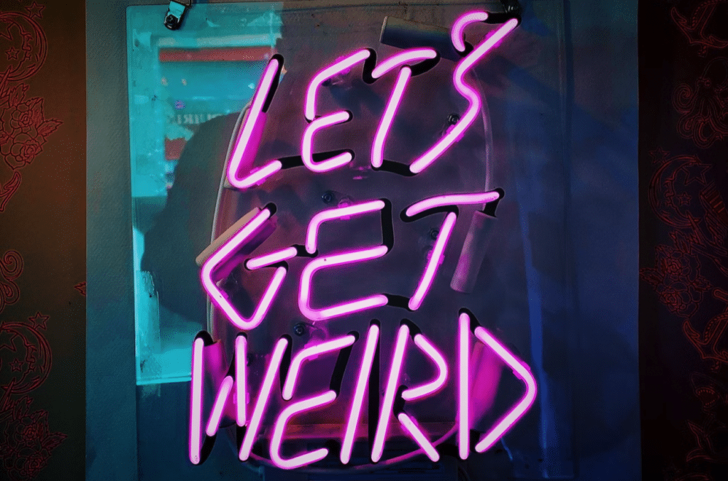 sign that says lets get weird, which is how we feel when we talk about how to produce a podcast