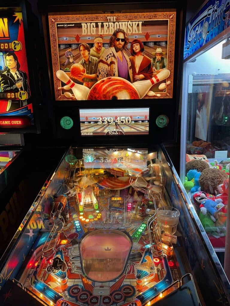 Collection of vintage pinball machines at North Star Machines, Montreal, featuring iconic designs like Flash Gordon, The Beatles, Stranger Things, and The Big Lebowski.