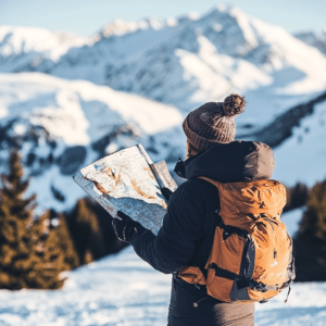 Skier holding a trail map with podcast logo, showcasing the value of planning.