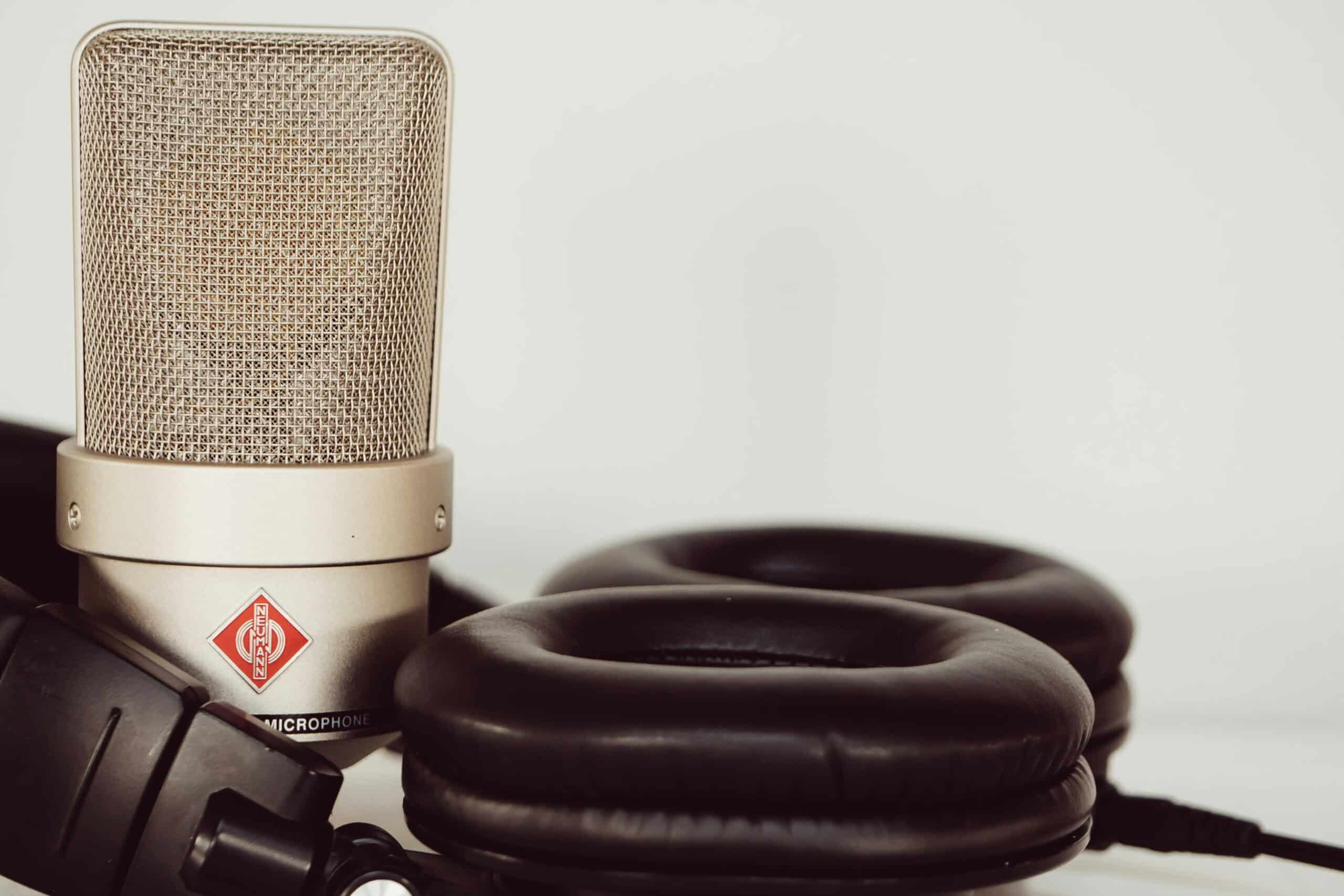Close up of podcast mic and headphones, used on blog about cultivating brand loyalty and brand fandom