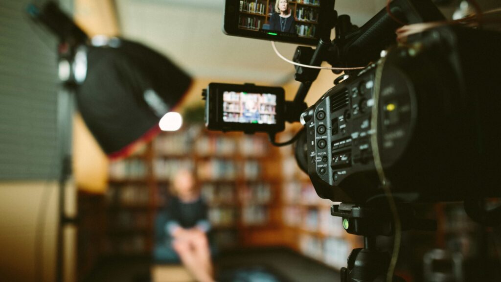 Close up shot of a professional video camera, used on blog about video podcasting platforms