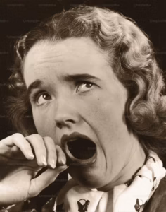 Vintage black-and-white photo of a woman yawning, illustrating the idea of a boring industry podcast.